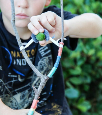DIY Stick Slingshot Kids Craft from Make and Takes