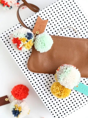 DIY Pom Pom Leather Luggage Tags by Sugar & Cloth