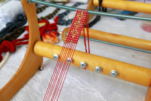 Loom beading is a combination of weaving and beading